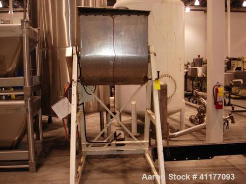Used Leland Paddle Mixer, 26 Cubic Feet, Stainless Steel. Non-jacketed trough 39" wide x 36'' long x approximately 36'' deep. T paddles driven by a 1/2 hp, 3/60/230/460 volt, 1745 rpm gear motor, rat...