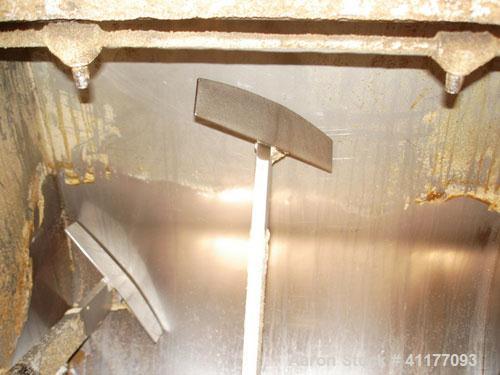 Used Leland Paddle Mixer, 26 Cubic Feet, Stainless Steel. Non-jacketed trough 39" wide x 36'' long x approximately 36'' deep. T paddles driven by a 1/2 hp, 3/60/230/460 volt, 1745 rpm gear motor, rat...