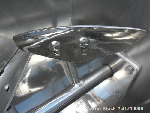 Used Marion Paddle Mixer, Model 1001, 1.5 cubic foot working capacity. 304 stainless steel clad; carbon steel outside. Non-jacketed trough 12" wide x 24" long x approximately 16" deep. 1-1/4" diamete...