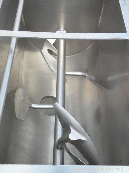 Used Marion Paddle Mixer, 15 Cubic Feet,  304 Stainless Steel. Non-jacketed trough 27-1/2" wide x 48" long x 35" deep. 3" diameter shaft with 4 paddles, (2) with end scrapers, welded to 1-1/2" diamet...