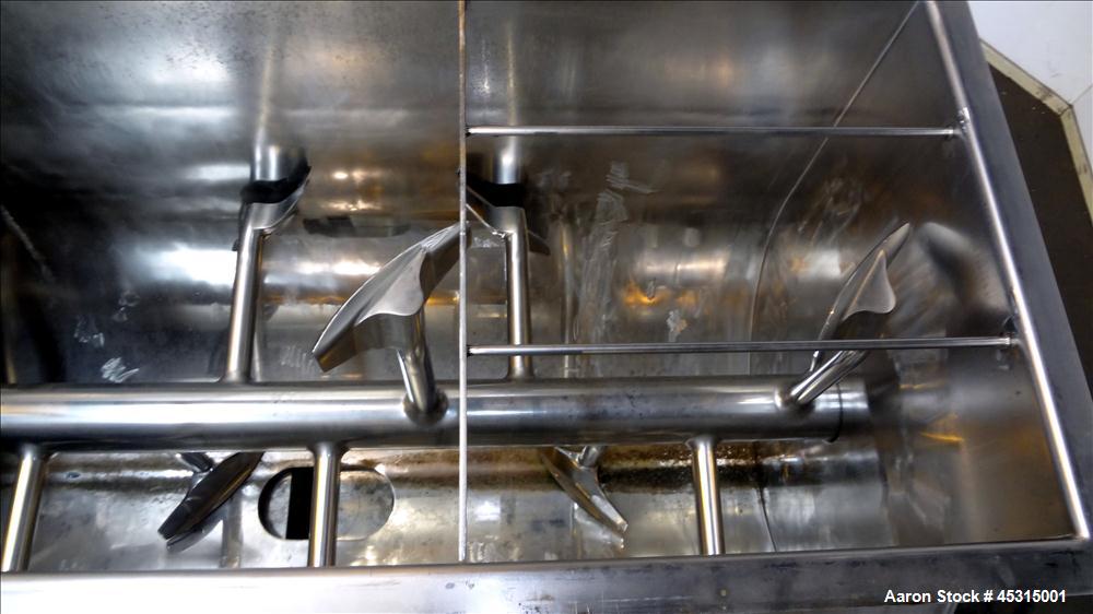 Used Marion Semi-Cylindrical Paddle Mixer, approximately 300 cubic feet working capacity, 304 stainless steel. Non-jacketed trough 55-1/2" wide at top opening to approximately 66" wide inside x 144" ...