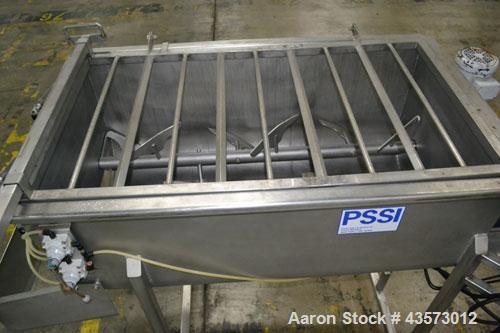 Used PSSI Twin Shaft Paddle Mixer, Approximate 33 Cubic Feet Working Capacity, 304 Stainless Steel. Non-jacketed trough 33-1/2" wide x 60" long x approximate 17-3/4" deep. Top hinged safety grate, du...