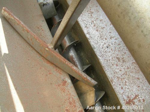 Used Weiler Paddle Mixer, Approximately 48 Cubic Foot Capacity, Carbon Steel. Trough measures 36" wide x 72" long x 50" deep.6" diameter screw discharge, 3" pitch.(4) paddle posts are 1" thickx 6" wi...