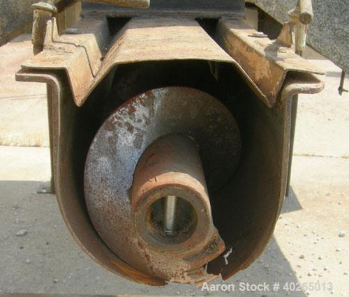 Used Weiler Paddle Mixer, Approximately 48 Cubic Foot Capacity, Carbon Steel. Trough measures 36" wide x 72" long x 50" deep.6" diameter screw discharge, 3" pitch.(4) paddle posts are 1" thickx 6" wi...