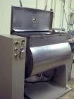 Used Baker Perkins Stainless Steel Paddle Mixer.  Maximum capacity 7 cubic feet (200 liters).  50 Hz.