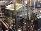 Used Karl Schnell Paddle Mixer, Stainless Steel. Approximately 140 cubic feet, 4000 Liter capacity. Has stainless steel feed hopper with dual screw conveyors, driven by (2) Approximate 5.4HP drive ge...