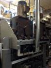 Used Karl Schnell Paddle Mixer, Stainless Steel. Approximately 140 cubic feet, 4000 Liter capacity. Has stainless steel feed hopper with dual screw conveyors, driven by (2) Approximate 5.4HP drive ge...
