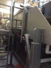 Used Karl Schnell Paddle Mixer, Stainless Steel. Approximately 140 cubic feet, 4000 Liter capacity. Has stainless steel feed hopper with dual screw conveyors, driven by (2) Approximate 5.4HP drive ge...