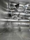 Used Karl Schnell Paddle Mixer, Stainless Steel. Approximately 140 cubic feet, 4000 Liter capacity. Has stainless steel feed hopper with dual screw conveyors, driven by (2) Approximate 5.4HP drive ge...