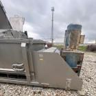 Used Karl Schnell Paddle Mixer, Stainless Steel. Approximately 140 cubic feet, 4000 Liter capacity. Has stainless steel feed hopper with dual screw conveyors, driven by (2) Approximate 5.4HP drive ge...