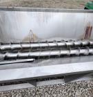 Used Karl Schnell Paddle Mixer, Stainless Steel. Approximately 140 cubic feet, 4000 Liter capacity. Has stainless steel feed hopper with dual screw conveyors, driven by (2) Approximate 5.4HP drive ge...