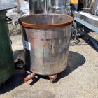 Used Buhler Removable Head Type Press-Out Unit. Designed to accept approximate 813mm diameter mixing tanks. This unit includes one(1) 32” diameter x 32” deep caster mounted stainless steel mixing tan...