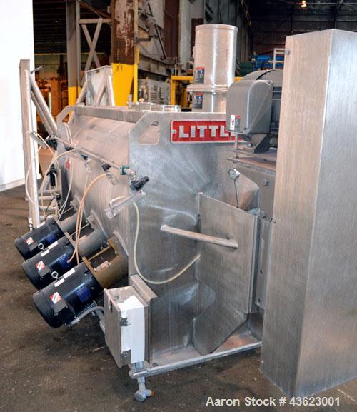 Used Littleford Batch Type Plow Mixer, Model FKM2000E, 321 Stainless Steel. 43 Cubic feet working capacity (73.5  total). Non-jacketed chamber approximate 50” diameter x 79” long. 5” Diameter shaft w...