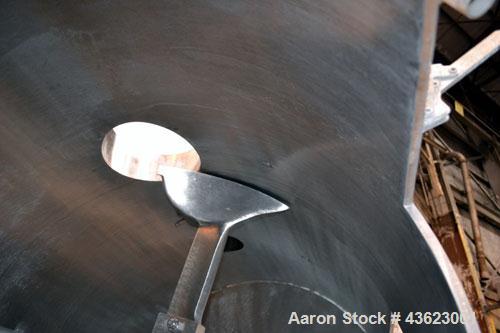 Used Littleford Batch Type Plow Mixer, Model FKM2000E, 321 Stainless Steel. 43 Cubic feet working capacity (73.5  total). Non-jacketed chamber approximate 50” diameter x 79” long. 5” Diameter shaft w...