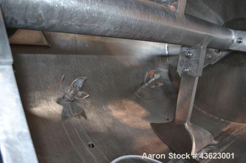 Used Littleford Batch Type Plow Mixer, Model FKM2000E, 321 Stainless Steel. 43 Cubic feet working capacity (73.5  total). Non-jacketed chamber approximate 50” diameter x 79” long. 5” Diameter shaft w...