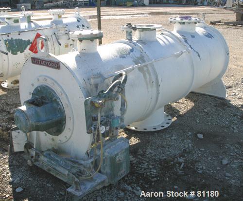 USED: Littleford plow mixer, model FKM1200D, batch type. 26.1 cubic foot working capacity, 43.4 total, 316 stainless steel. Non-jacketed chamber 32" diameter x 99" straight side. 5" diameter shaft wi...
