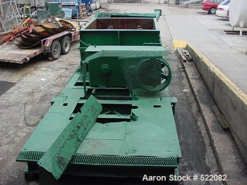 USED: Pug mill, dual shaft carbon steel paddle blender. Trough is7' long x 6' wide x 3'10" deep. Overall dimensions are 29' long x7'7" wide x 5' high. Discharge opening is 30" x 20". The gearbox is15...