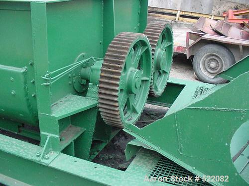 USED: Pug mill, dual shaft carbon steel paddle blender. Trough is7' long x 6' wide x 3'10" deep. Overall dimensions are 29' long x7'7" wide x 5' high. Discharge opening is 30" x 20". The gearbox is15...