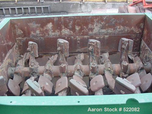 USED: Pug mill, dual shaft carbon steel paddle blender. Trough is7' long x 6' wide x 3'10" deep. Overall dimensions are 29' long x7'7" wide x 5' high. Discharge opening is 30" x 20". The gearbox is15...