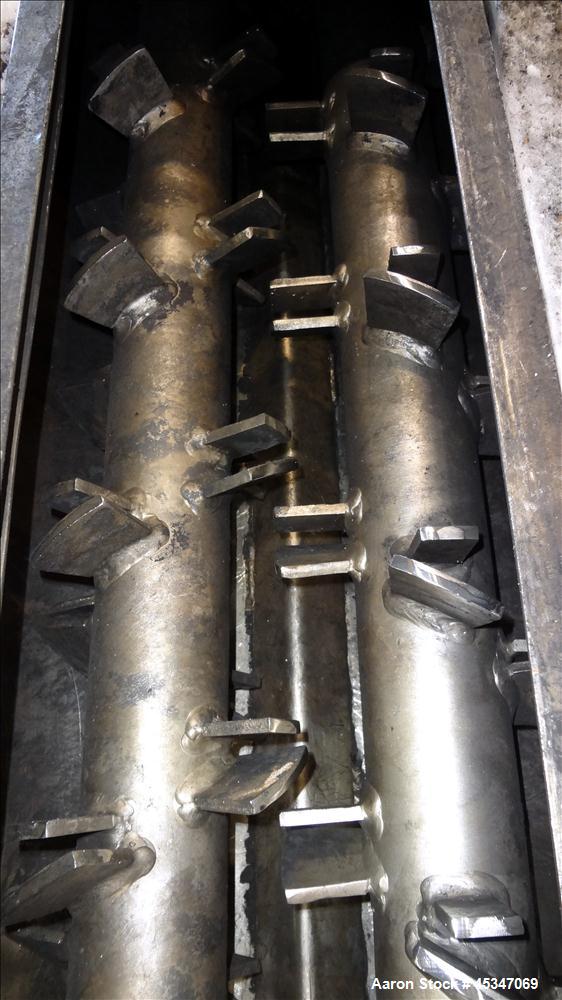 Used KWS Continuous Twin Shaft Paddle Mixer/Pug Mill, 304 Stainless Steel. (2) 6" Diameter x 165" long shafts with fixed paddles. Trough 13" wide x 165" long, bolt on top cover with openings. Driven ...