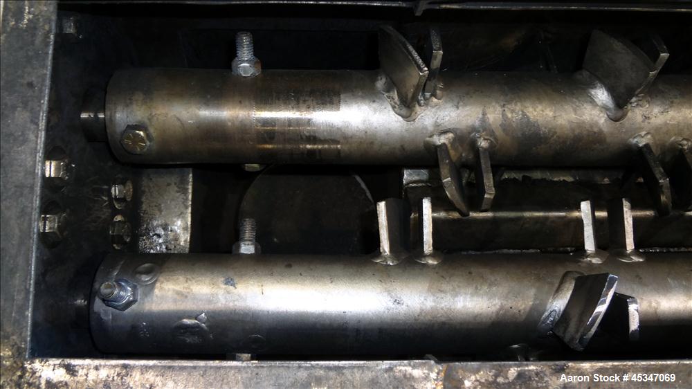 Used KWS Continuous Twin Shaft Paddle Mixer/Pug Mill, 304 Stainless Steel. (2) 6" Diameter x 165" long shafts with fixed paddles. Trough 13" wide x 165" long, bolt on top cover with openings. Driven ...