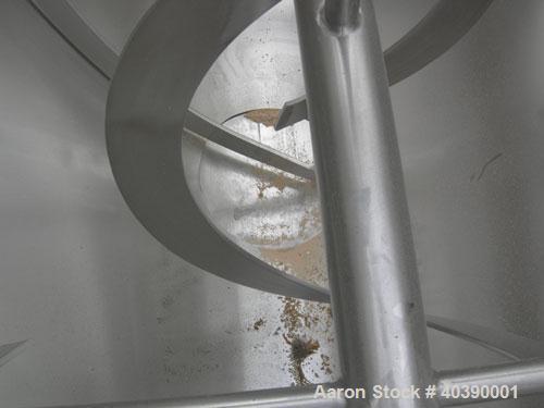 Used Double spiral ribbon blender, approximate 29 cubic feet working capacity, 304 stainless steel. Non-Jacketed trough 72" long x 28" wide x approximately 31" deep.  2 1/2" diameter shaft,  inner ri...