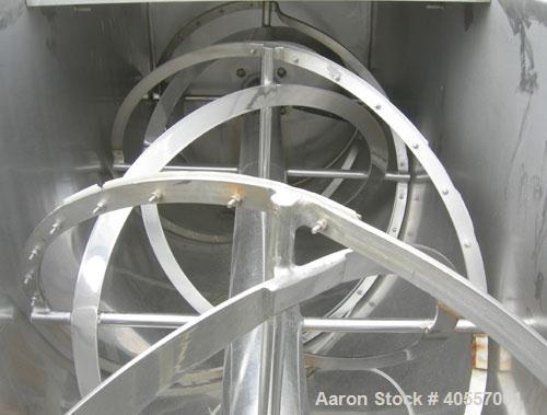 Used Double Spiral Ribbon Blender, 64 cubic feet working capacity, 304 stainless steel. Non-jacketed trough 36" wide x 96" long x approximately 41" deep. 5 1/2" diameter shaft, inner ribbon 2" wide x...