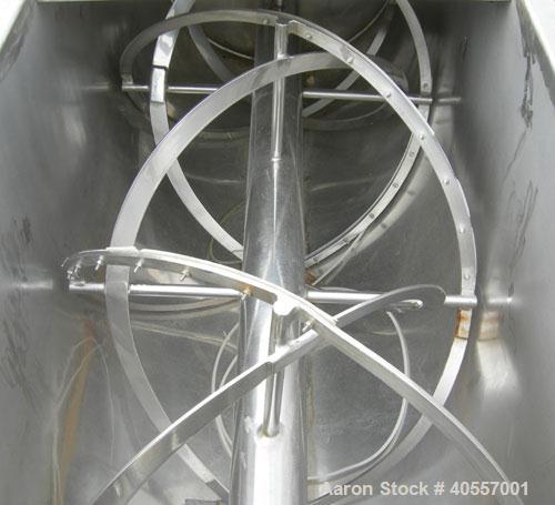 Used Double Spiral Ribbon Blender, 64 cubic feet working capacity, 304 stainless steel. Non-jacketed trough 36" wide x 96" long x approximately 41" deep. 5 1/2" diameter shaft, inner ribbon 2" wide x...
