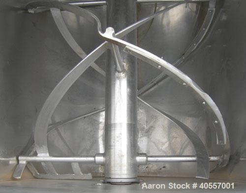 Used Double Spiral Ribbon Blender, 64 cubic feet working capacity, 304 stainless steel. Non-jacketed trough 36" wide x 96" long x approximately 41" deep. 5 1/2" diameter shaft, inner ribbon 2" wide x...