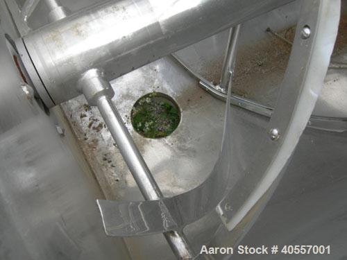 Used Double Spiral Ribbon Blender, 64 cubic feet working capacity, 304 stainless steel. Non-jacketed trough 36" wide x 96" long x approximately 41" deep. 5 1/2" diameter shaft, inner ribbon 2" wide x...