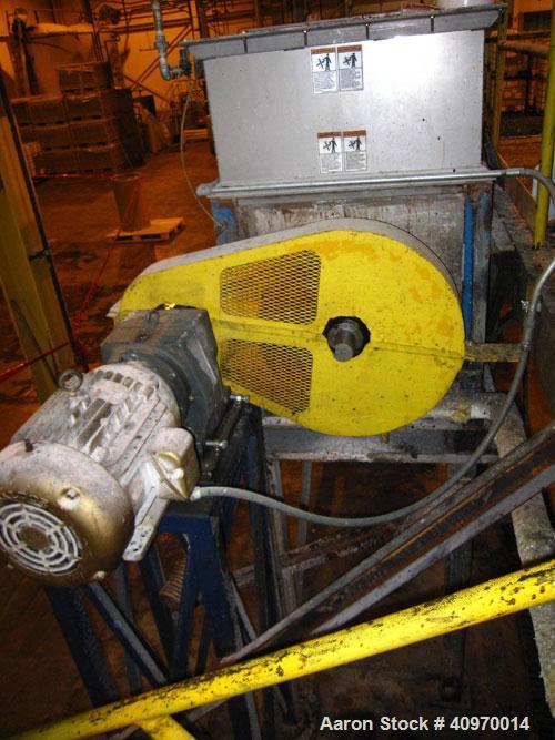 Used Ribbon Blender, Approximately  80 Cubic Feet, Stainless Steel, Double Ribbon.  4" end bottom outlet.  With cover and grate.  15 hp drive.