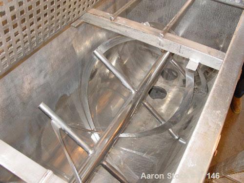 USED: Double spiral ribbon blender, 36 cubic feet working capacity, stainless steel. Non-jacketed trough 30" wide x 78" long x approximately 36" deep. 3" diameter shaft, inner ribbon 2" wide x 1/4" t...