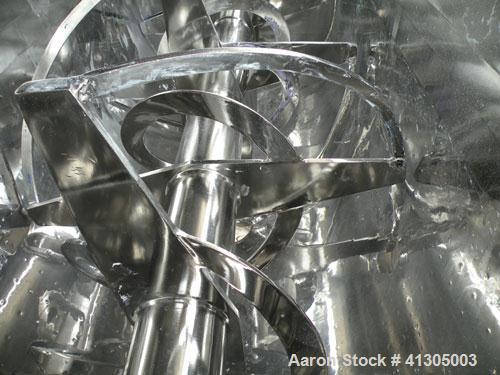 Used Aaron Process Double Spiral Ribbon Blender, 100 cubic feet working capacity (116 total), model NR100, 304 stainless steel. Dimple jacketed trough 48" wide x 96" long x approximately 54" deep. 8"...