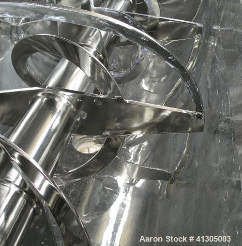 Used Aaron Process Double Spiral Ribbon Blender, 100 cubic feet working capacity (116 total), model NR100, 304 stainless steel. Dimple jacketed trough 48" wide x 96" long x approximately 54" deep. 8"...