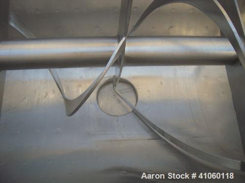 Used Aaron Process Double Spiral Ribbon Blender, 14 Cubic Feet Working Capacity, 304 Stainless Steel. Dimple jacketed trough 24" wide x 48" long  x approximately 27 1/2" deep, rated 100 psi at 350 de...