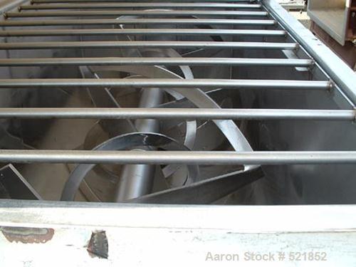 USED: Aaron stainless steel single shaft double ribbon blender, 80cu ft capacity. 40" wide x 8' long, 1/2" x 2" inner and outer ribbons,safety grate and covers, 10" diameter center bottom outlet with...