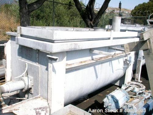 Used Aaron Process double spiral ribbon blender, 80 cubic feet working capacity, stainless steel. Non-jacketed trough 40" wide x 96" long x approximately 46" deep. 6" diameter shaft, inner ribbon 1 1...