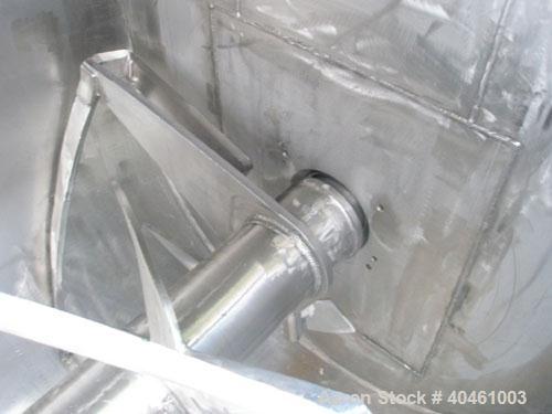 Used Aaron Process double spiral ribbon blender, 80 cubic feet working capacity, stainless steel. Non-jacketed trough 40" wide x 96" long x approximately 46" deep. 6" diameter shaft, inner ribbon 1 1...