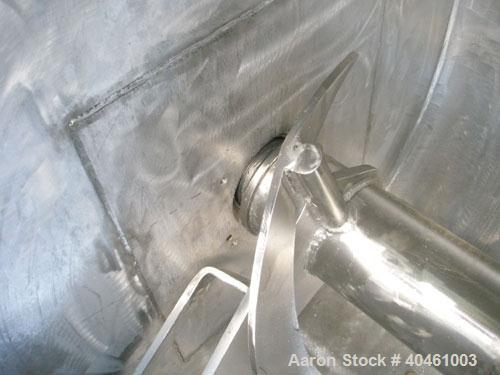 Used Aaron Process double spiral ribbon blender, 80 cubic feet working capacity, stainless steel. Non-jacketed trough 40" wide x 96" long x approximately 46" deep. 6" diameter shaft, inner ribbon 1 1...