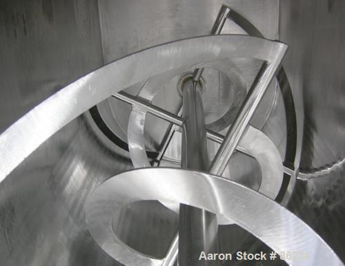 USED: Aaron double spiral ribbon blender, 36 cubic feet working capacity, 304 stainless steel. Non-jacketed trough 30" wide x 77" long x approximately 33" deep. 2-3/4" diameter shaft, inner ribbon 1-...