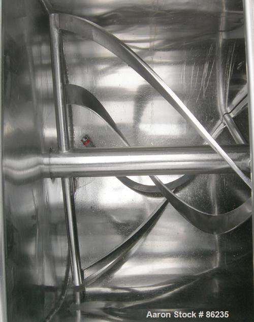 USED: Aaron double spiral ribbon blender, 36 cubic feet working capacity, 304 stainless steel. Non-jacketed trough 30" wide x 77" long x approximately 33" deep. 2-3/4" diameter shaft, inner ribbon 1-...