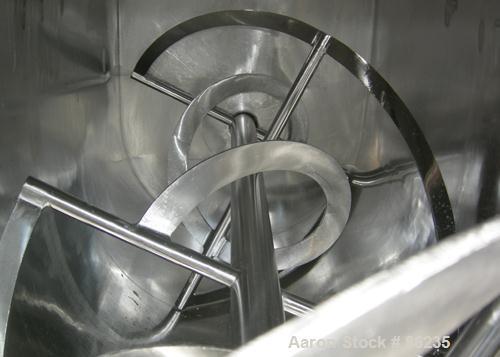 USED: Aaron double spiral ribbon blender, 36 cubic feet working capacity, 304 stainless steel. Non-jacketed trough 30" wide x 77" long x approximately 33" deep. 2-3/4" diameter shaft, inner ribbon 1-...