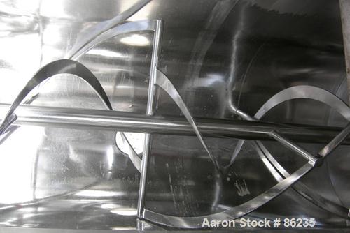 USED: Aaron double spiral ribbon blender, 36 cubic feet working capacity, 304 stainless steel. Non-jacketed trough 30" wide x 77" long x approximately 33" deep. 2-3/4" diameter shaft, inner ribbon 1-...
