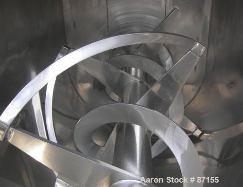 USED: Aaron Process double spiral ribbon blender, 80 cubic feet working capacity, 304 stainless steel. Non-jacketed trough 40" wide x 96" long x approximately 48" deep. 6" diameter shaft. Inner ribbo...