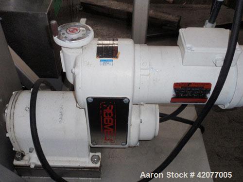 Used Paul O Abbe Double Spiral Ribbon Blender, model HM-1, 1 cubic foot, 316 stainless steel. 12" wide x 16" long trough, double ribbon, outboard roller bearings, packing glands, 3" outlet with a man...