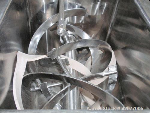 Used Paul O Abbe Double Spiral Ribbon Blender, model HM-1, 1 cubic foot, 316 stainless steel. 12" wide x 16" long trough, double ribbon, outboard roller bearings, packing glands, 3" outlet with a man...