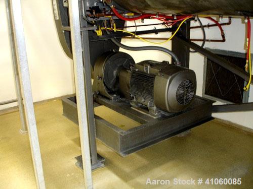 Used Areco Ribbon Blender, 125 cubic feet, stainless steel construction. 48" wide x 120" long trough, double ribbon, outboard roller bearings, air purge seals, jacketed trough, chain and sprocket dri...
