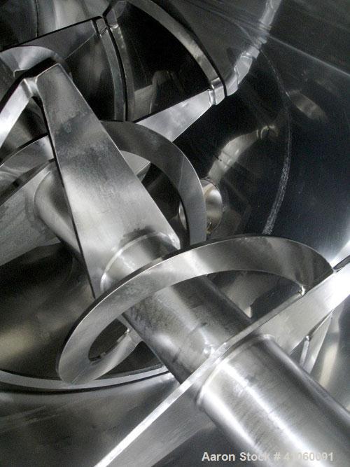 Used Areco Ribbon Blender, 125 cubic feet, stainless steel construction. 48" wide x 120" long trough, double ribbon, outboard roller bearings, air purge seals, jacketed trough, chain and sprocket dri...