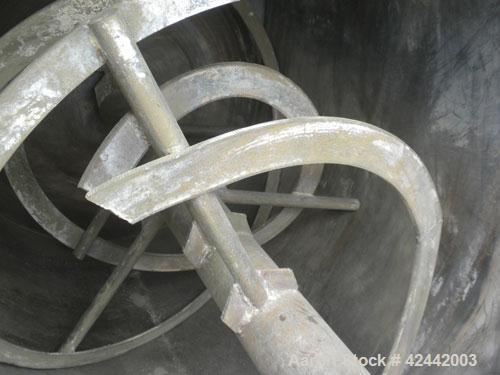 Used Champion Line Machinery Double Spiral Ribbon Blender, 113 cubic feet working capacity, carbon steel. Non-Jacketed trough 48" wide x 96" long x approximately 53" deep. 6" diameter shaft, inner ri...
