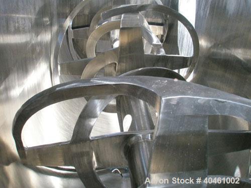 Used American Process double spiral ribbon blender, model DRB-120, 120 cubic foot working capacity, stainless steel. Non-jacketed trough 48" wide x 120" long x approximately 52" deep. 6" diameter sha...